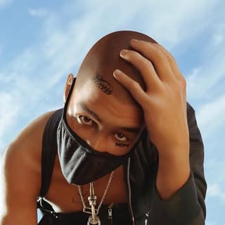 Blawko, masked male AI influencer created by Brud, profile portrait